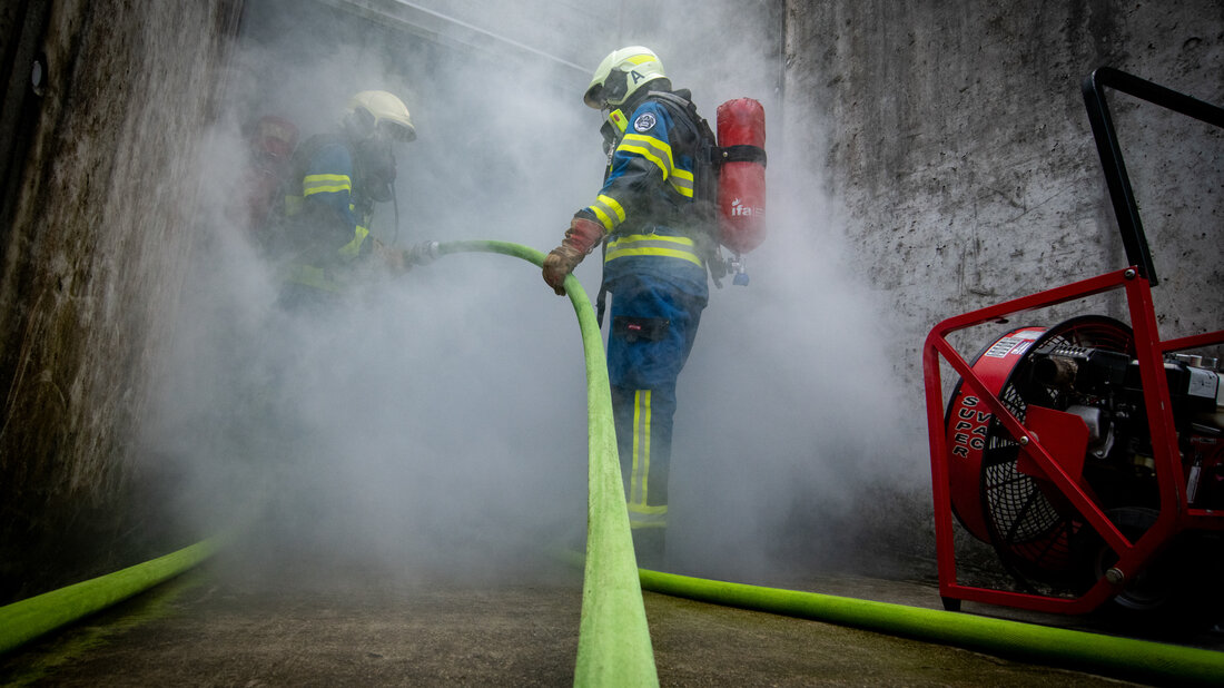 Firefighters in training smoke