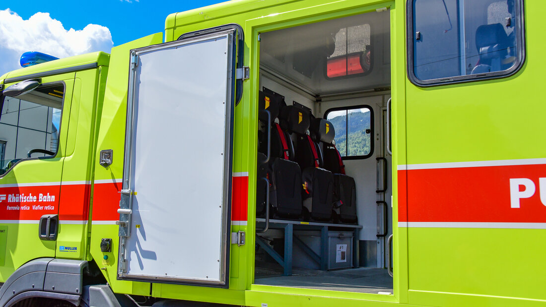 Road-rail vehicle with the door to the crew cabin opened