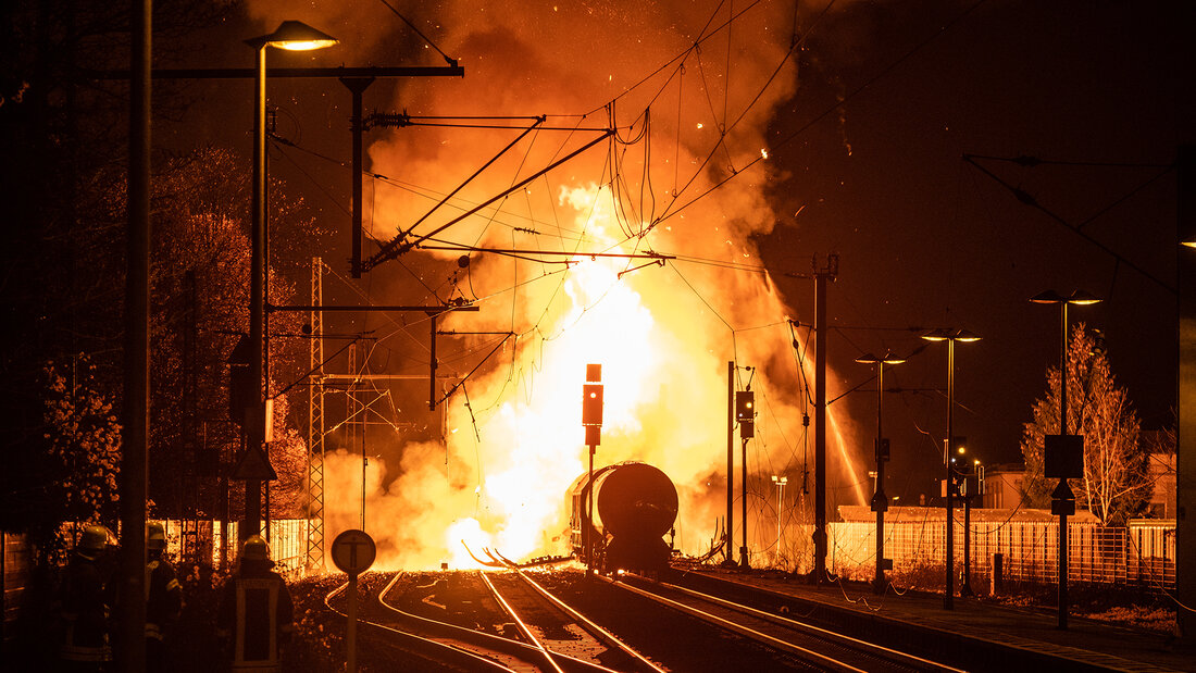 Burning freight train in the urban area