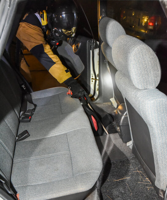 Search in limousine The footwell of a car is searched