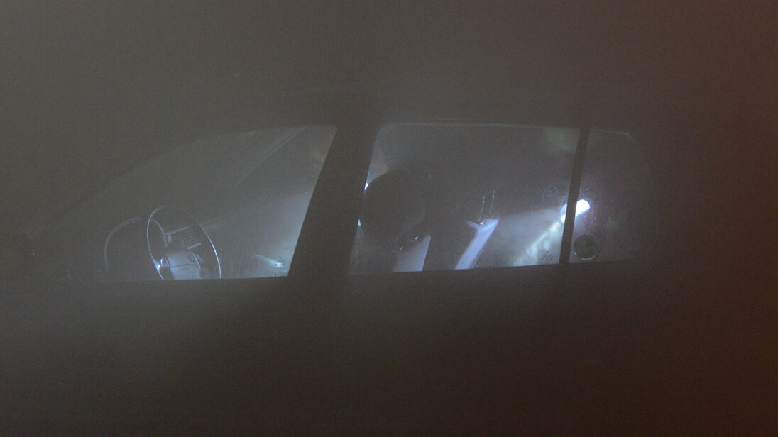 Searching a vehicle in a dark and smoke-filled tunnel