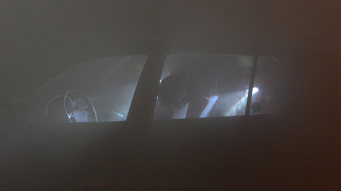 Searching a vehicle in a dark and smoke-filled tunnel Searching a vehicle in a dark and smoke-filled tunnel