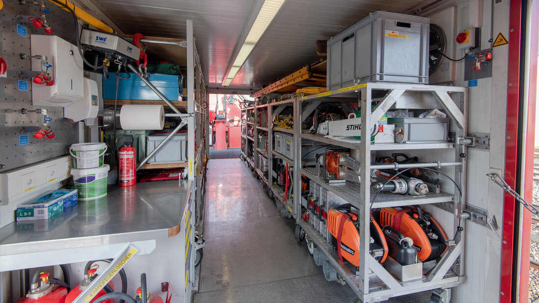 Equipment vehicle of a fire and rescue train, with many different tools and machines.