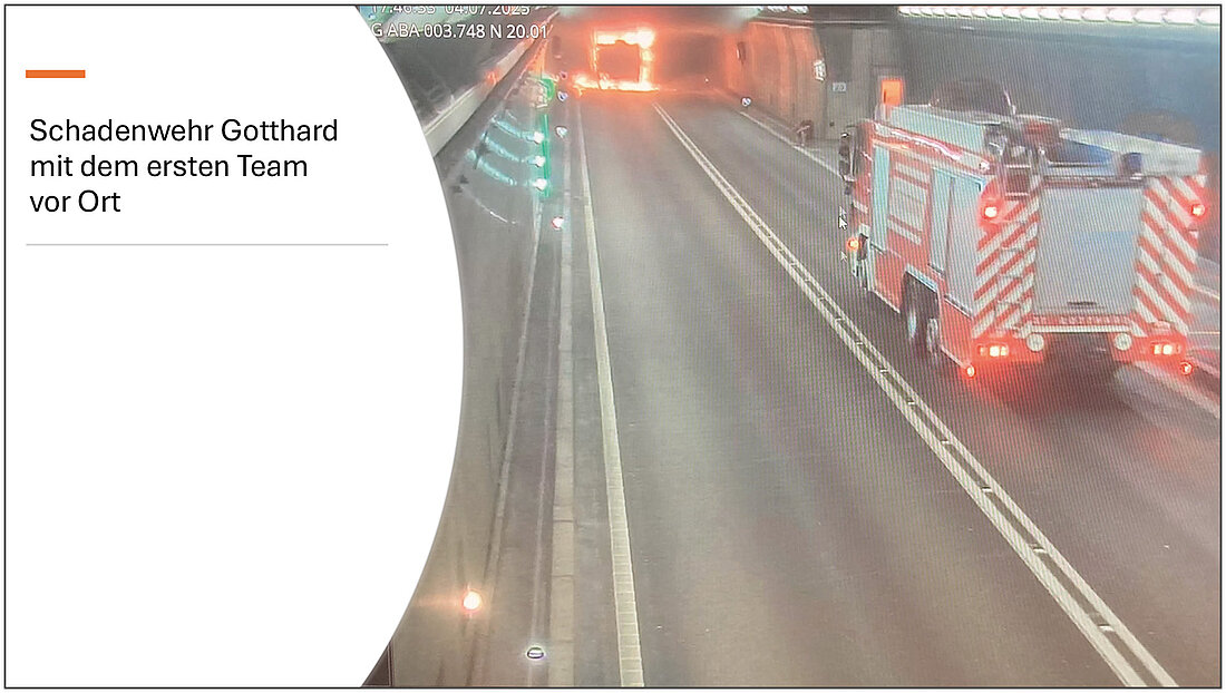 Bild der Tunnelkamera zeigt die brennende Fahrerkabine und das anrückende Löschfahrzeug der Gotthard Schadenwehr